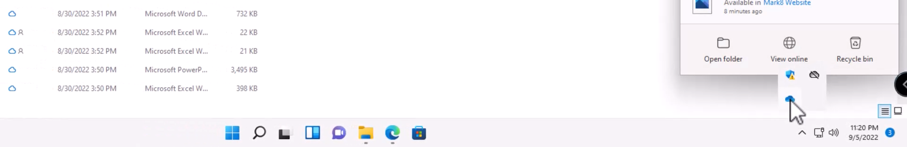 Screenshot showing the tray open with the blue OneDrive icon